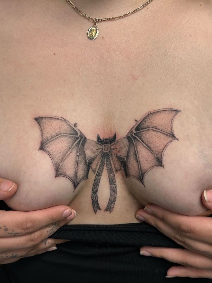 Moth sternum tattoo