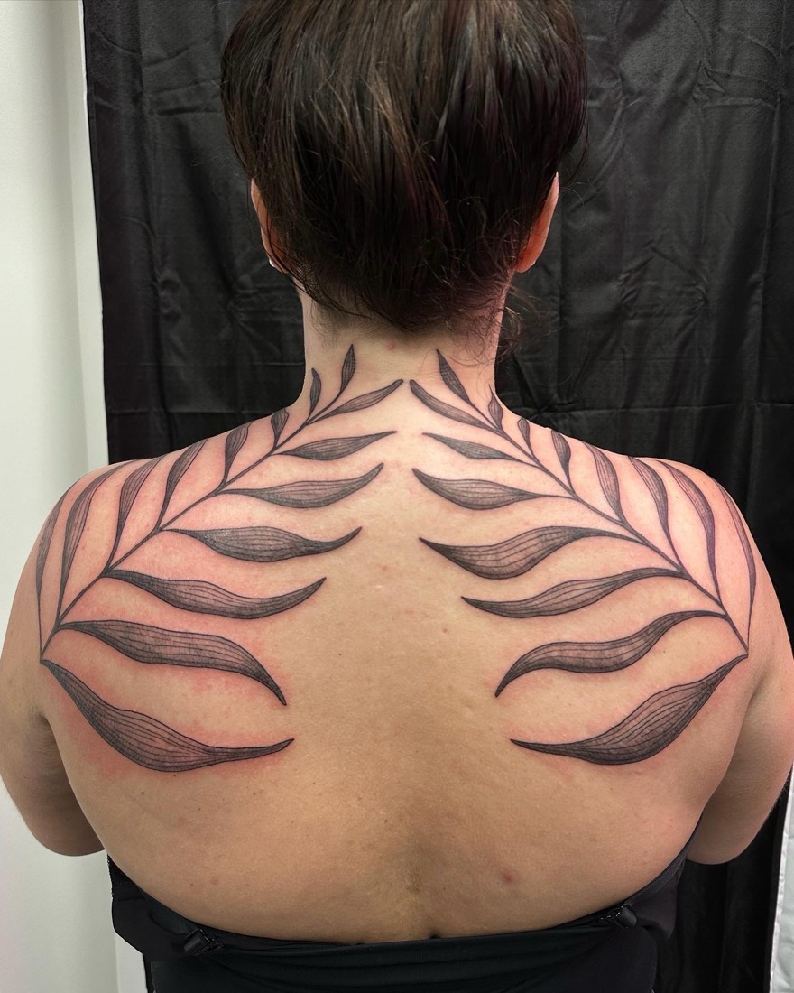 Ornamental spine tattoo