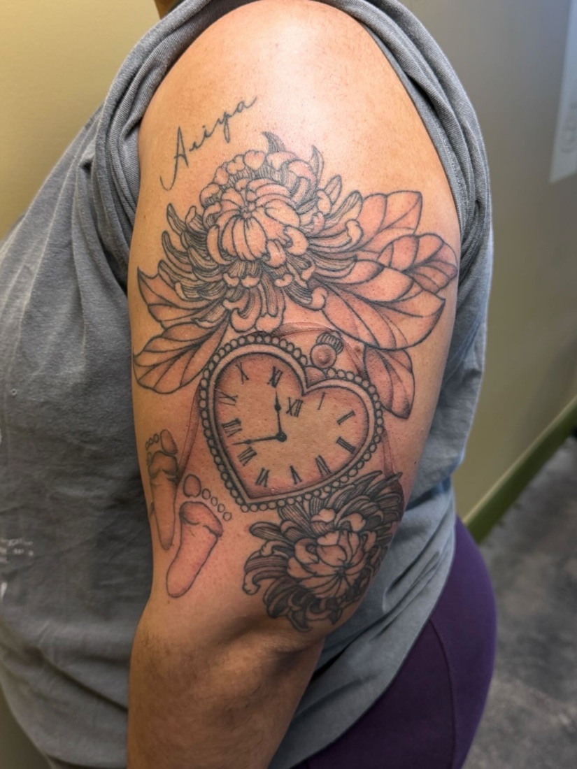 Ornamental clock and florals half sleeve