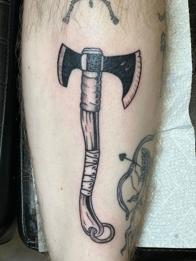 Blackwork axe tattoo