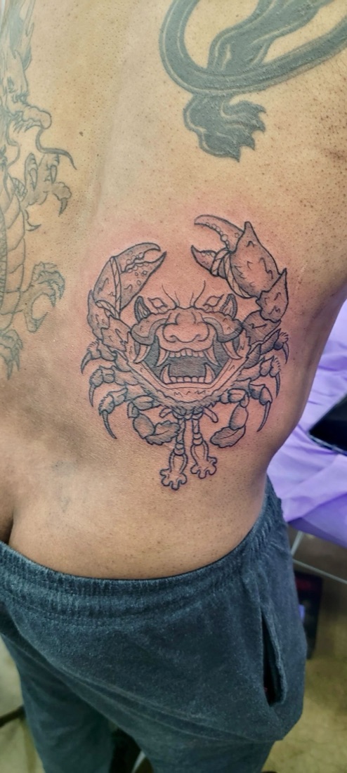 Blackwork crab tattoo